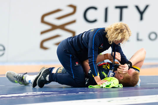 Jim Gottfridsson of Sweden receives medical attention