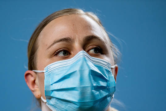 Frida Åkerström of Sweden wears a face mask