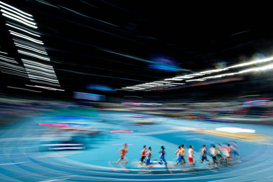 Athletes compete in men's 1500 meter qualification