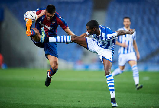Alexander Isak of Real Sociedad duels for the ball with