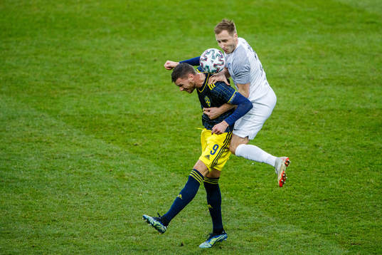 Marcus Berg of Sweden and Sander Puri of Estonia