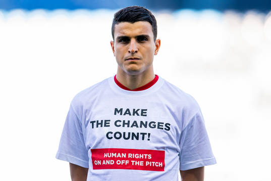 Mohamed Elyounoussi of Norway wearing a t-shirt with the