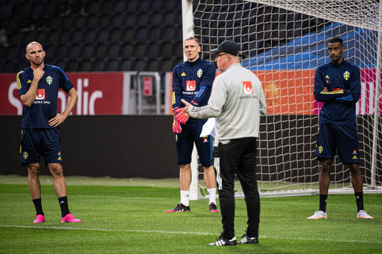 Marcus Danielson, Robin Olsen and Alexander Isak listen to