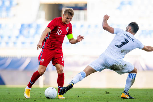 Martin Ødegaard of Norway and Giorgos Tzavelas of Greece