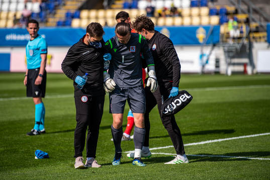 Goalkeeper Tim Kips of Luxembourg in pain
