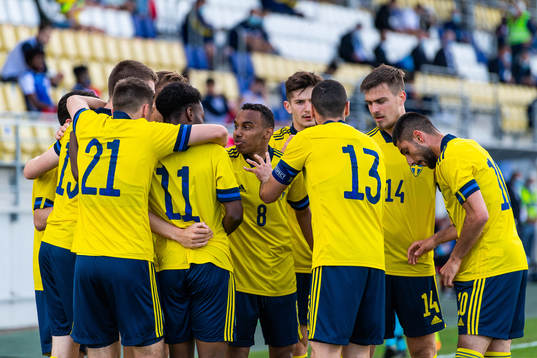 Bilal Hussein (middle) celebrates with team mates