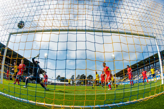 Emil Holm of Sweden scores 1-0 behind goalkeeper Tim Kips