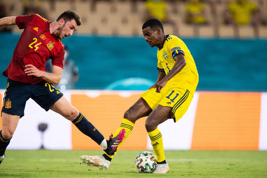 Aymeric Laporte of Spain and Alexander Isak of Sweden