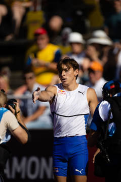 Armand Duplantis of Sweden asks the photographers to move