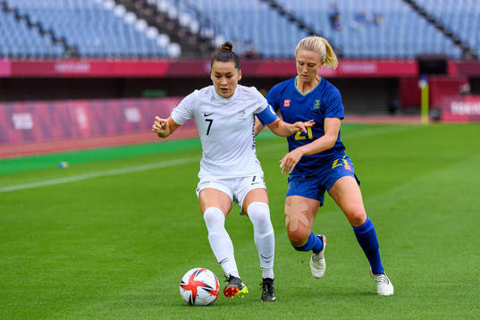 Ali Riley of New Zealand and Rebecka Blomqvist of Sweden