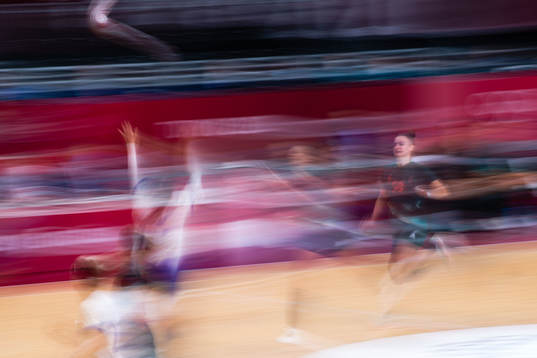 Players compete in the women's handball match between