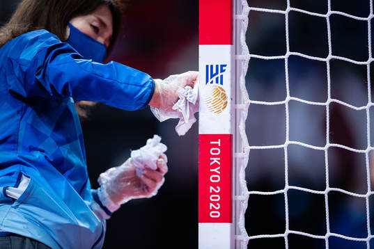 Officials cleans the goal between games