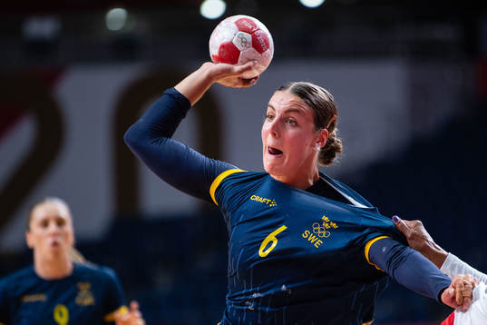 compete in the women's handball match between Sweden and