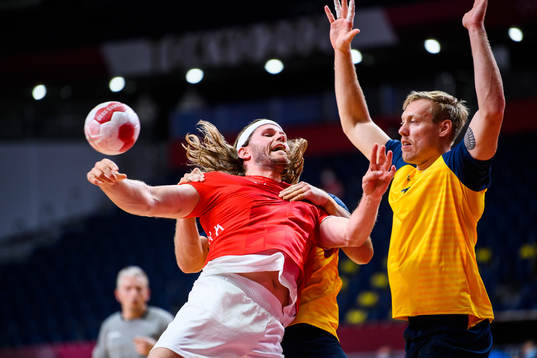 Mikkel Hansen of Denmark and Fredric Pettersson of Sweden