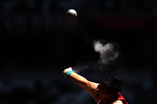 Lijiao Gong of China competes to win women’s shot put