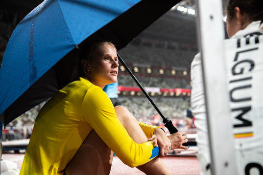Michaela Meijer of Sweden with an umbrella due to heavy