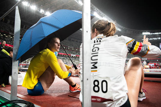 Michaela Meijer of Sweden with an umbrella due to heavy