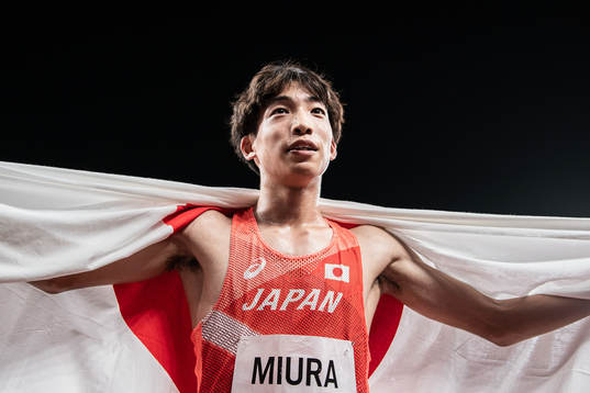 Ryuji Miura of Japan celebrates