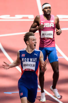 Karsten Warholm of Norway reacts in front of Rai Benjamin