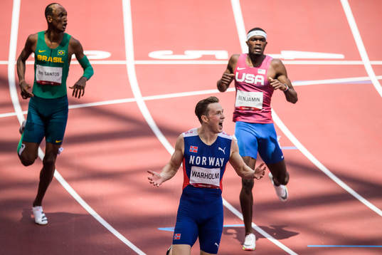 Karsten Warholm of Norway reacts in front of Alison dos