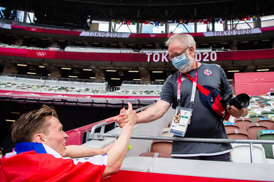 Karsten Warholm of Norway celebrates with Leif Olav Alnes,