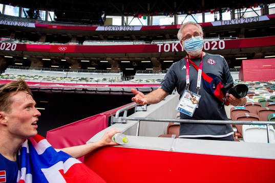 Karsten Warholm of Norway celebrates with coach Leif Olav