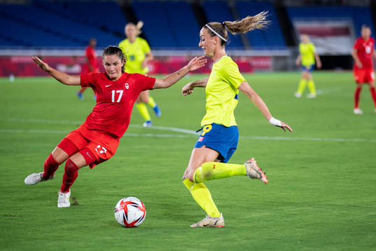 Jessie Fleming of Canada and Kosovare Asllani of Sweden in