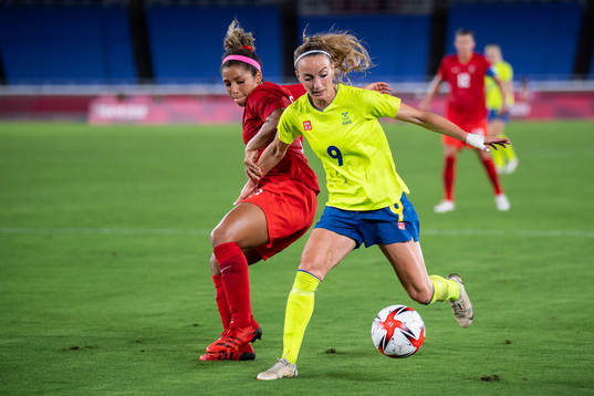 Desiree Scott of Canada and Kosovare Asllani of Sweden in