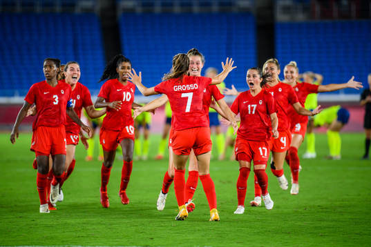 Julia Grosso of Canada celebrates with teammates
