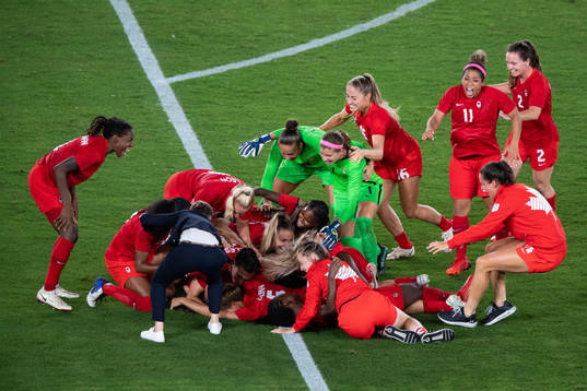Players of Canada celebrates winning and players of Sweden