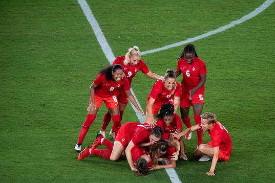 Players of Canada celebrates winning and players of Sweden