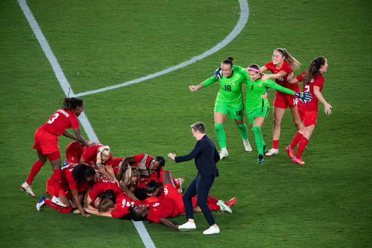 Players of Canada celebrates winning and players of Sweden