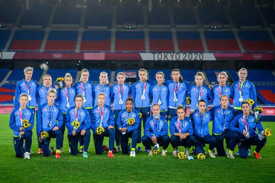 Players of Sweden pose for a photo