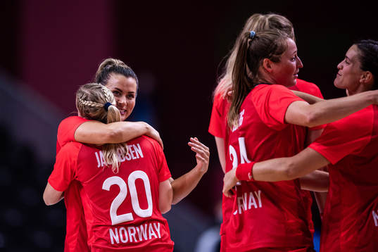 Nora Mørk of Norway celebrate with teammates