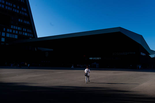 A man walks outside Bossard Arena