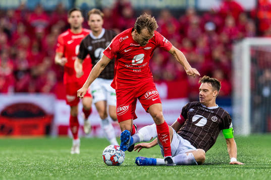 Bård Finne of Brann and Markus Nakkim of Mjøndalen