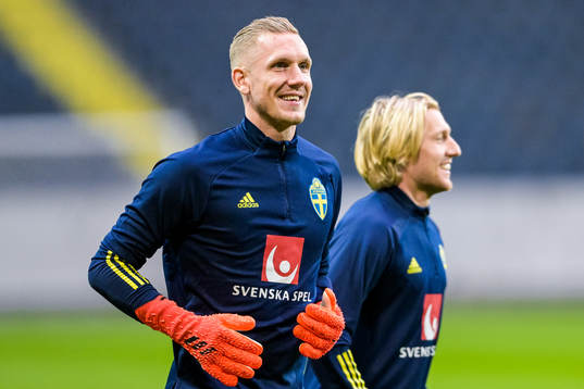 Goalkeeper Robin Olsen and Emil Forsberg  of the Swedish