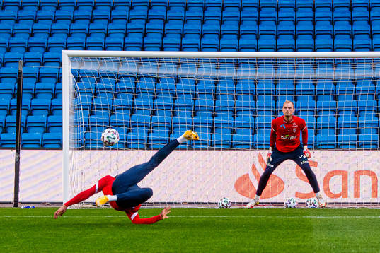 Ohi Omoijuanfo and goalkeeper Viljar Myhra of the Norwegian