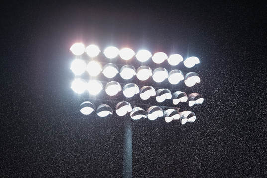 Rain is seen in front of the flood lights