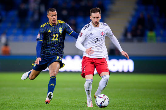Robin Quaison of Sweden and Otar Kakabadze of Georgia