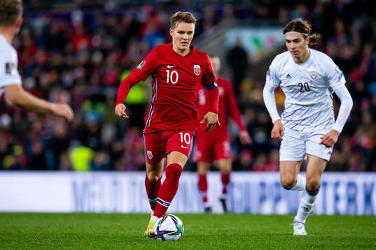 Martin Ødegaard of Norway and Roberts Uldrikis of Latvia