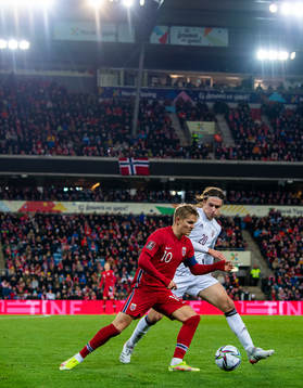 Martin Ødegaard of Norway and Roberts Uldrikis of Latvia