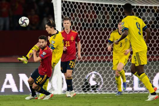 Jordi Alba of Spain and Kristoffer Olsson of Sweden