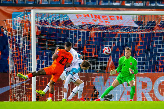 Memphis Depay of Netherlands and goalkeeper Ørjan