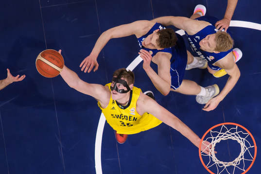 Simon Birgander of Sweden in action against Mikael Jantunen