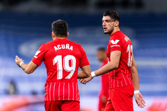 Marcos Acuna and Rafa Mir of Sevilla