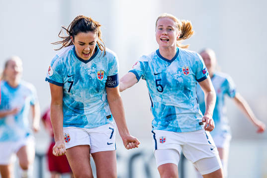 Ingrid Syrstad Engen of Norway celebrates with teammate