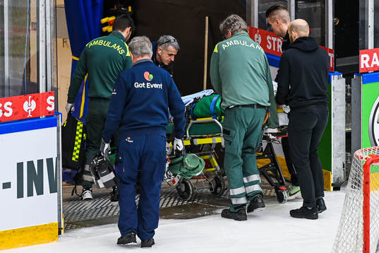 Anton Bengtsson of Rögle is transported off the ice
