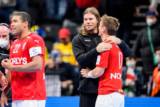 Mikkel Hansen and Lasse Svan of Denmark celebrate