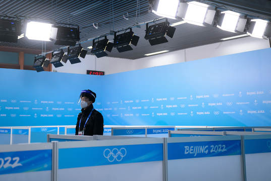 A man with personal protective gear stands guard in the